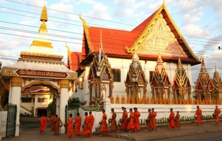 Monks queue Laos temple