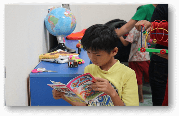 A pupil concentrates on reading book